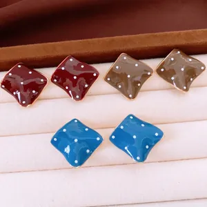 Three pairs of vintage rhombus polka-dot earrings in red, khaki, and blue with gold edges