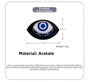 Detail view of Evil Eye acetate hair claw clip showing 7.6cm x 4.6cm size and 26g weight