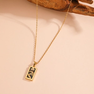 Detail shot of vintage tarot sun necklace with black enamel and sparkling crystals