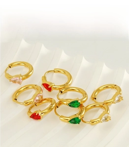 Detail of pear-cut zircon hoop earrings in pink, red, green and white on a display stand