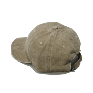 Detail of vintage washed cotton baseball cap with adjustable strap and breathable eyelets