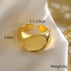 Macro shot of gold geometric ring on silk showing width 1.4cm and 1.7-1.9cm inner diameter