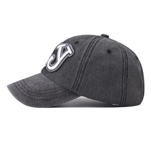 Detail view of washed grey cotton baseball cap with 3D letter J embroidery on side