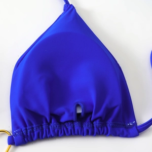 Detail of royal blue triangle bikini top with ruched hem and side metal ring