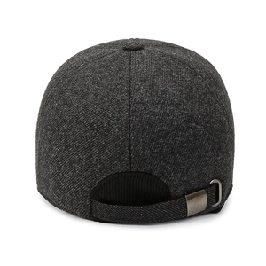 Rear view of dark grey winter baseball cap with metal buckle and warm wool texture