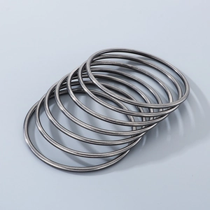 Detail of 7 pieces of 3mm gunmetal grey titanium steel bangles stacked together