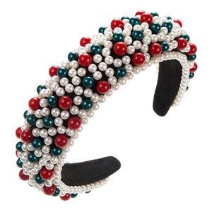 Vue détaillée du serre-tête rembourré avec perles festives rouges, blanches et vertes