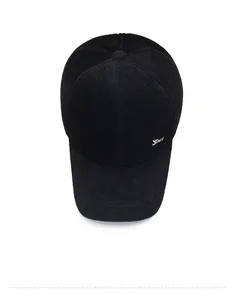 Top view of a thick black faux mink baseball cap with silver sport logo metal detail