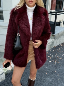 Close-up of elegant wine red faux fur coat showing soft texture and premium mid-length cut