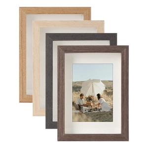 Set of four minimalist wood grain photo frames in natural, grey, and walnut finishes