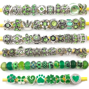 Silver alloy charms with green crystals and heart patterns for DIY bracelets