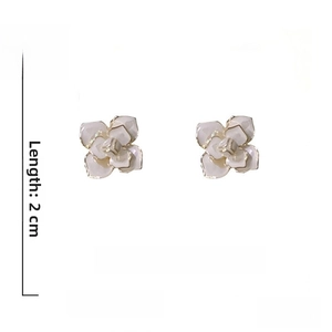 Detailed specs of camellia stud earrings with white petals and 925 silver needles