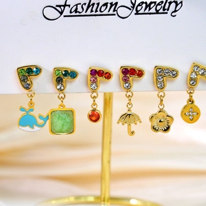 Chic 6-piece gold earring set with colorful rhinestones and diverse charms on display