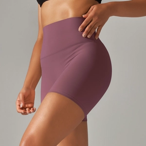 Detailed back view of high-waisted dark purple yoga shorts with butt-lifting fit