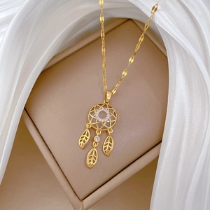 Luxury gold dreamcatcher necklace with white rhinestones and hollow leaf pendants on silk