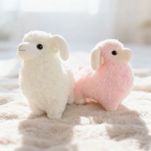 Cute plush sheep toy set in white and pink colors with fluffy wool and curled horns