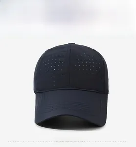 Detailed front view of navy sports cap featuring laser-cut breathable holes and stitching