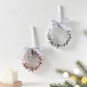 Handmade Christmas wreath pendants with mini bells and silk bows for festive home decor