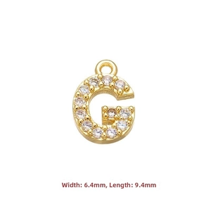 Macro detail of gold letter G pendant featuring micro-set white cubic zirconia stones