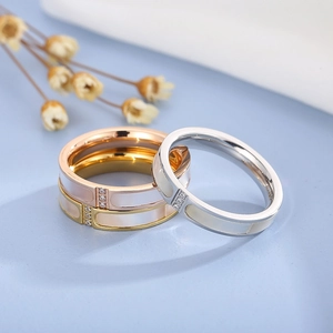 Detailed close-up of tricolor CNC rings with shell inlay and micro zircon settings