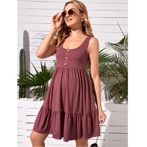 Detail of dusty pink maternity tank dress featuring wood buttons and knit texture