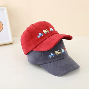 Detail of red and grey cotton kids baseball caps with embroidered cartoon car graphics