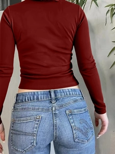 Women Y2K red ribbed knit crop top long sleeve shirt shown from the back view