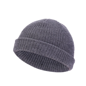 Detailed close-up of dark grey knitted beanie showing fine stitch texture and rolled cuff