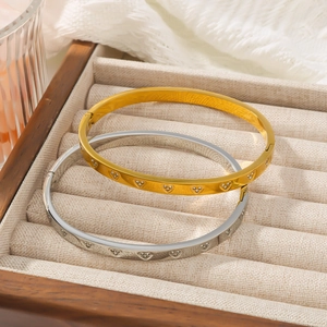 Elegant stainless steel heart bangles with crystal inlay in gold and silver finishes