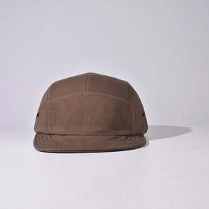 Detail view of brown 5-panel camping cap with cotton twill fabric and metal eyelets