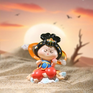 Dunhuang flying goddess figurine on desert sand with sunset background decor