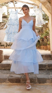 Detail of light blue tiered organza dress with layers and spaghetti straps