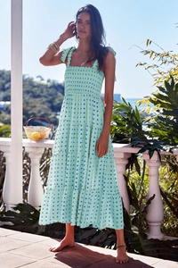 Detail of mint green plaid tiered dress with smocked bodice and adjustable bow straps