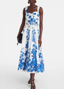 Detail of blue floral crop top and high-waisted midi skirt with white waist tie cord