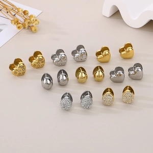Selection of heart and teardrop hoop earrings in gold and silver polished finishes
