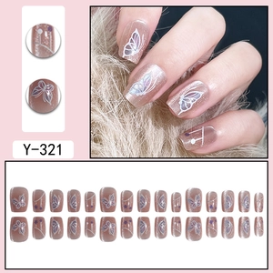 Cat eye butterfly press-on nails in nude pink with glitter and 3D white line designs