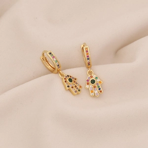 Macro shot of gold Hamsa hand earrings with colorful micro-pave cubic zirconia crystals
