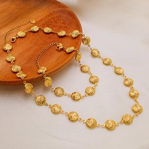 Unisex gold stainless steel necklace and bracelet set with textured spiral round pendants