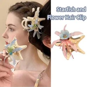 Starfish hair claw with flowers and long ribbons for elegant beach hairstyles