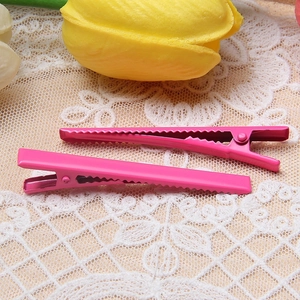 Set of two pink 6cm metal duckbill hair clips on white lace with a yellow tulip