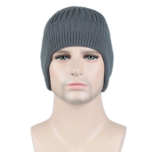 Front view of a men's gray ribbed knit beanie showing soft texture on a male model