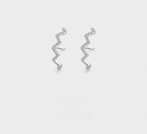 Detailed close-up of S925 sterling silver wave earrings with sparkling zircon stones