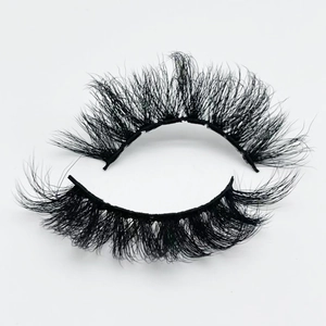 Macro detail of 20mm fluffy faux mink eyelashes featuring dense and curly black fibers
