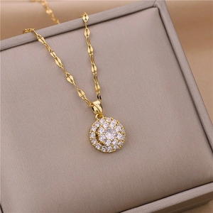 Rotating gold titanium necklace with sparkling zircon pendant on a luxury gray display box