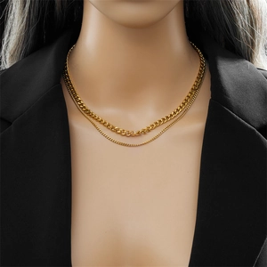 Close-up of double layered gold plated stainless steel chain necklace on model