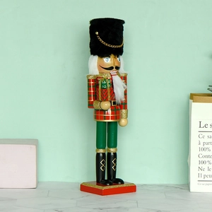 30cm Nutcracker soldier in red and green plaid outfit holding a Christmas gift box