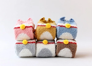 Close-up of thick coral fleece socks in 6 colors with cute 3D animal ears and pom-poms