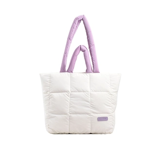 Quilted padded tote bag in white with purple handles and fashion label detail