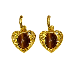 Vintage gold heart earrings with brown resin stone and rhinestone accents on white background