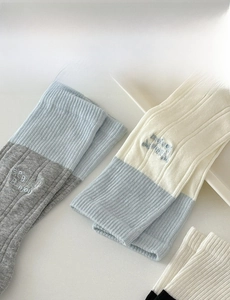Detail of cotton crew socks featuring Bebe Bonjour embroidery and contrast color cuffs